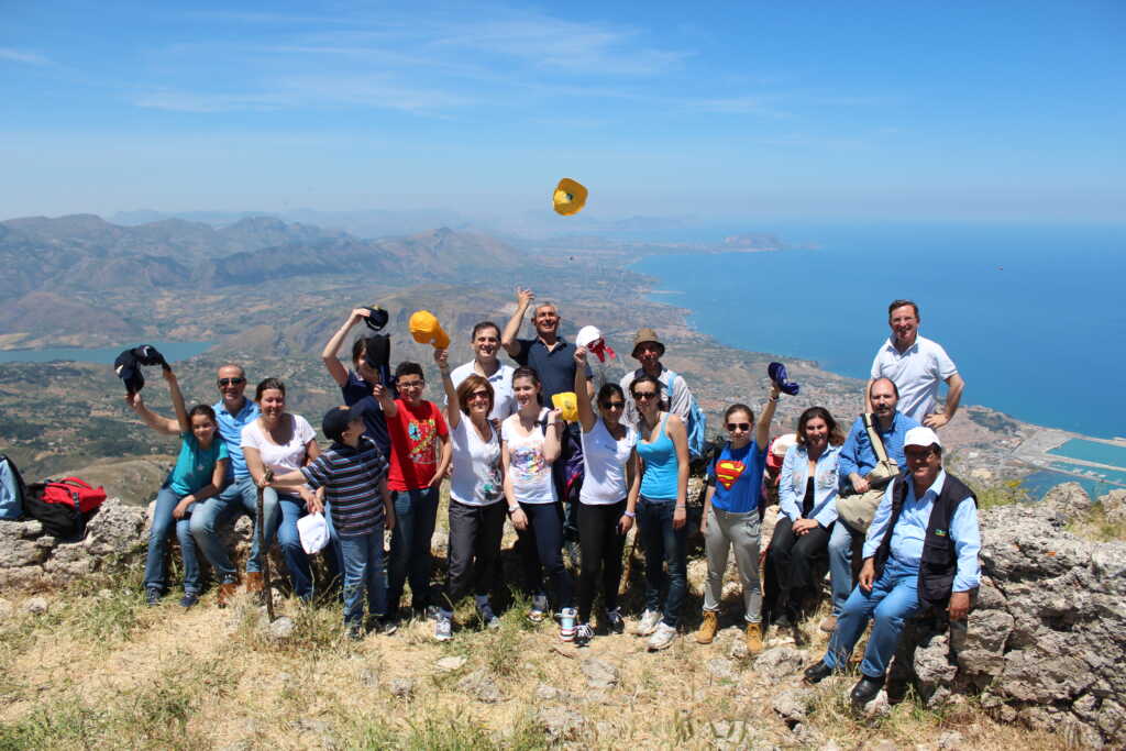 team-with-their-kids-posing-after-a-hike