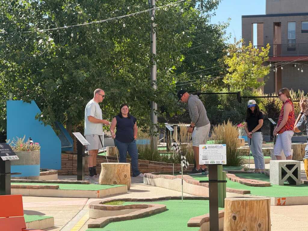 Text-expander-team-playing-mini-golf