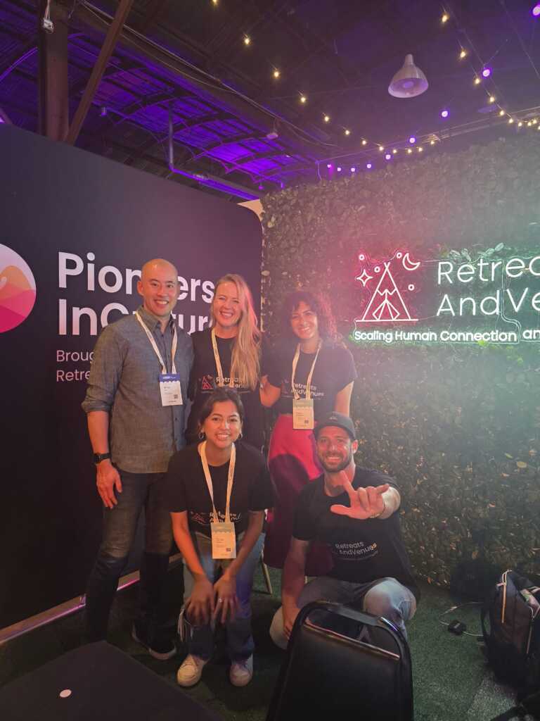 R&V-team-posing-in-their-booth-at-running-remote-conference-2025