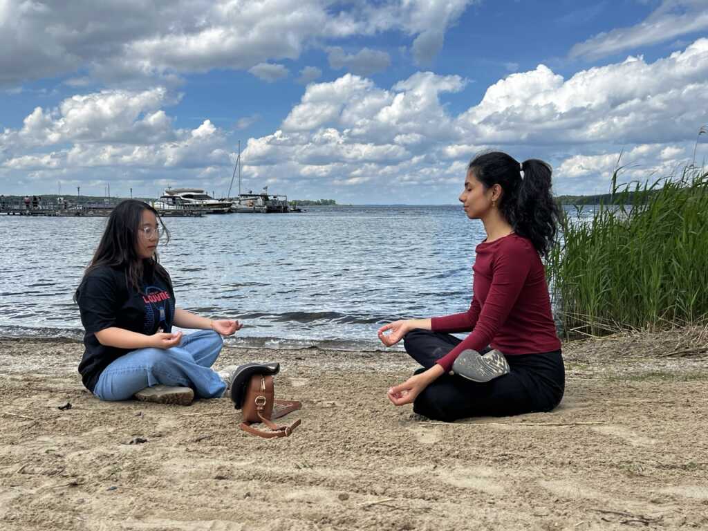 Two expatrio employees meditating