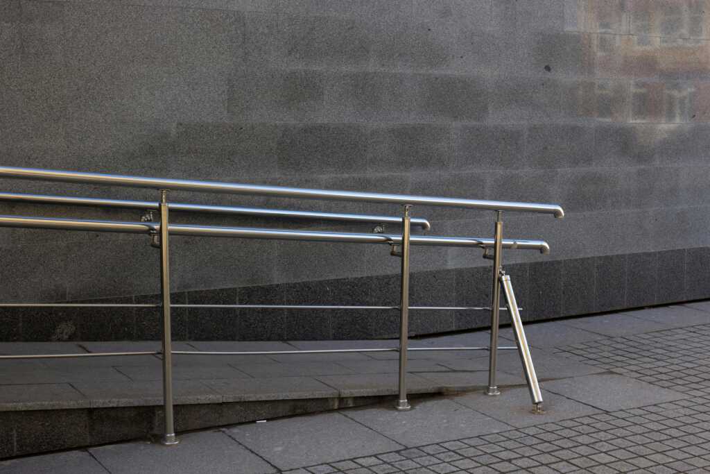 Image of an accessibility ramp outside of a building.